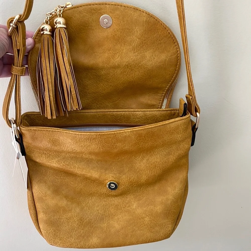 Alyssa vegan leather flap over crossbody handbag purse with tassels. NWT